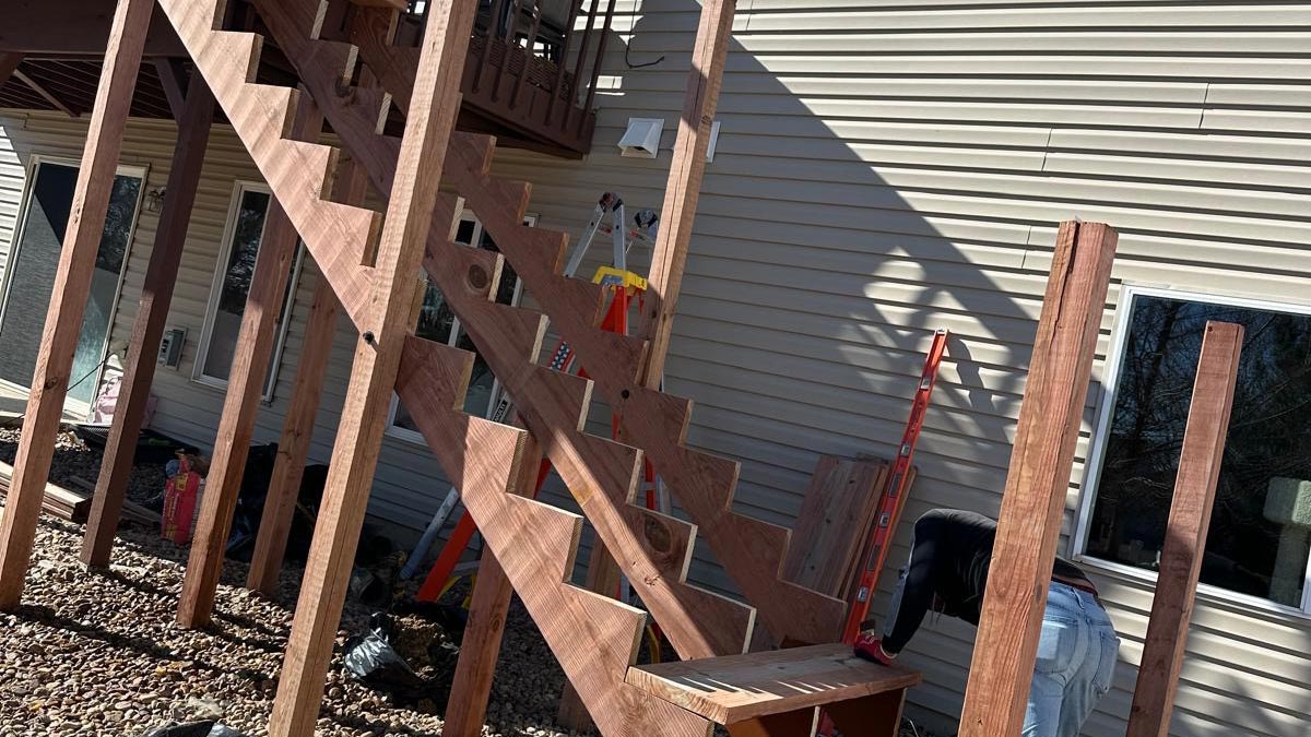 Deck Staircase Finished wooden deck staircase descending from an elevated deck at a Denver-area home