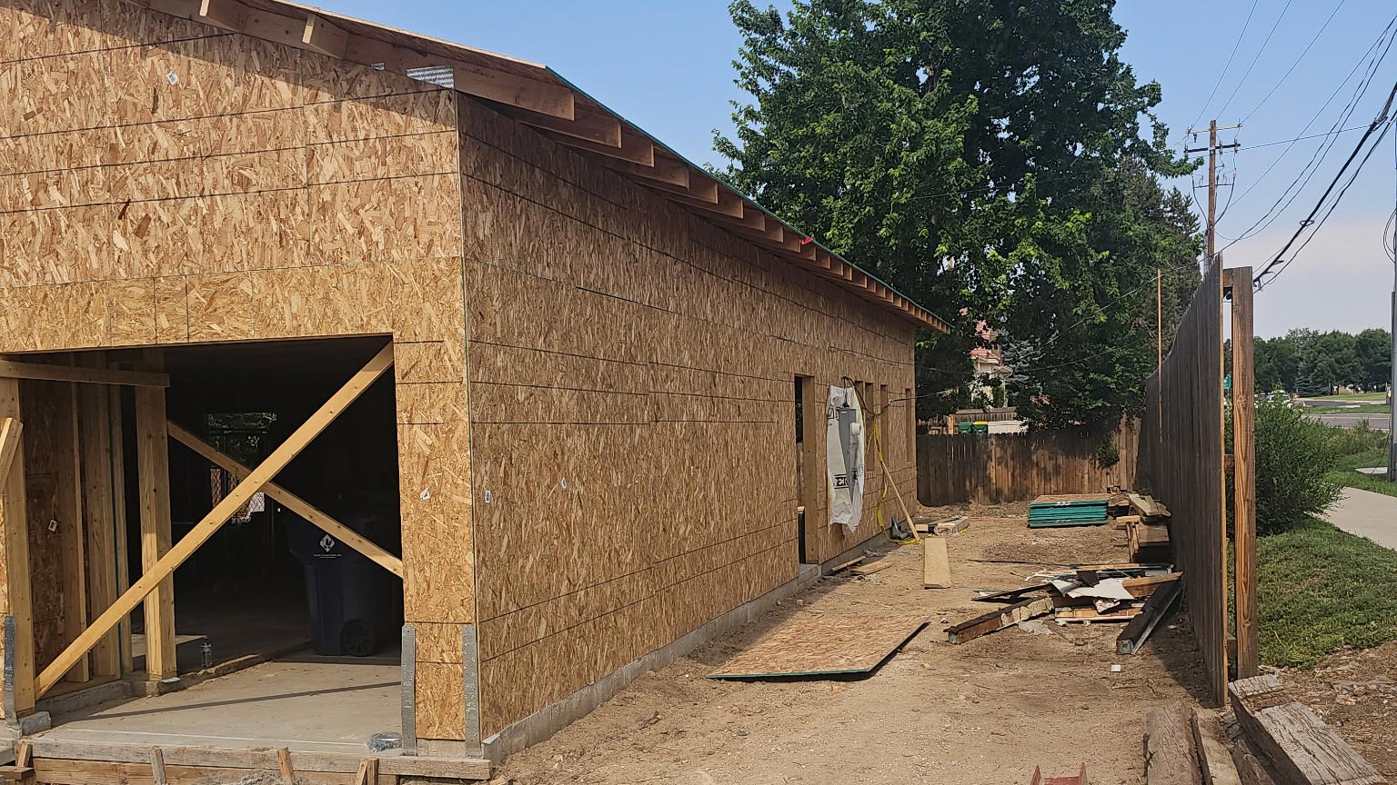 Detached Garage Shell Detached garage under construction with OSB sheathing installed and the roofline framed