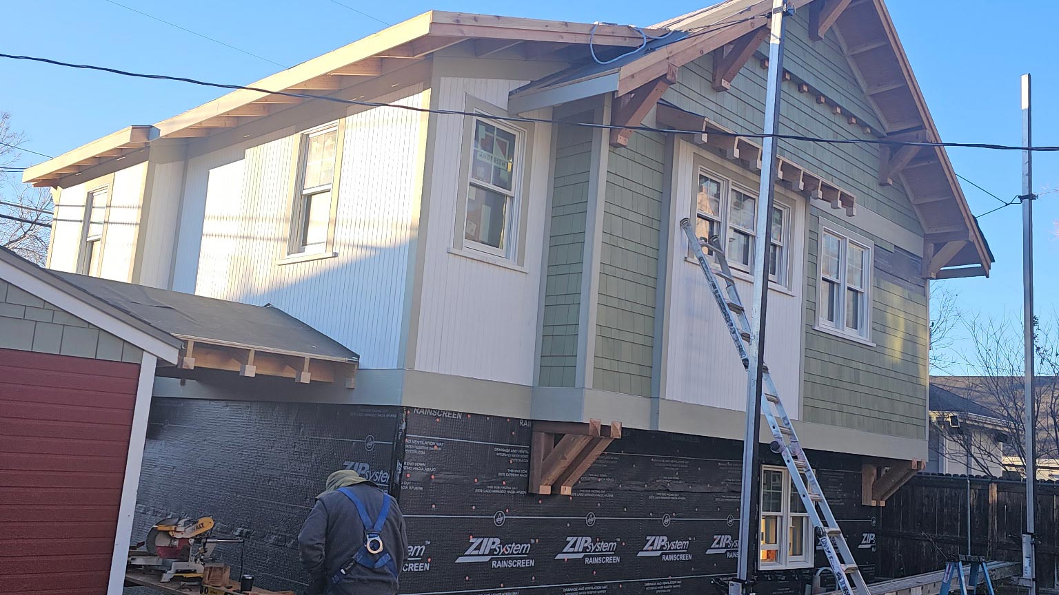 Sage Green Fiber-Cement Siding Craftsman-style gable with new sage green fiber-cement lap siding and white trim