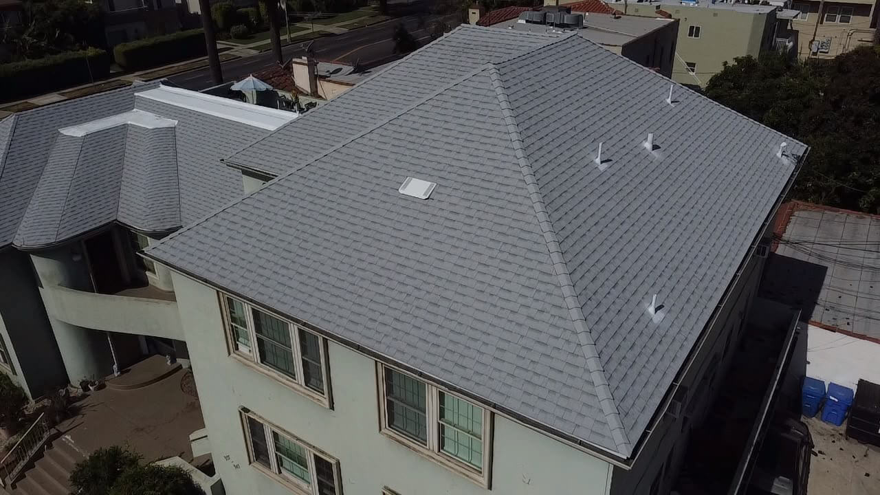 New Asphalt Shingle Hip Roof New architectural asphalt shingle hip roof from above with fresh vents and skylight